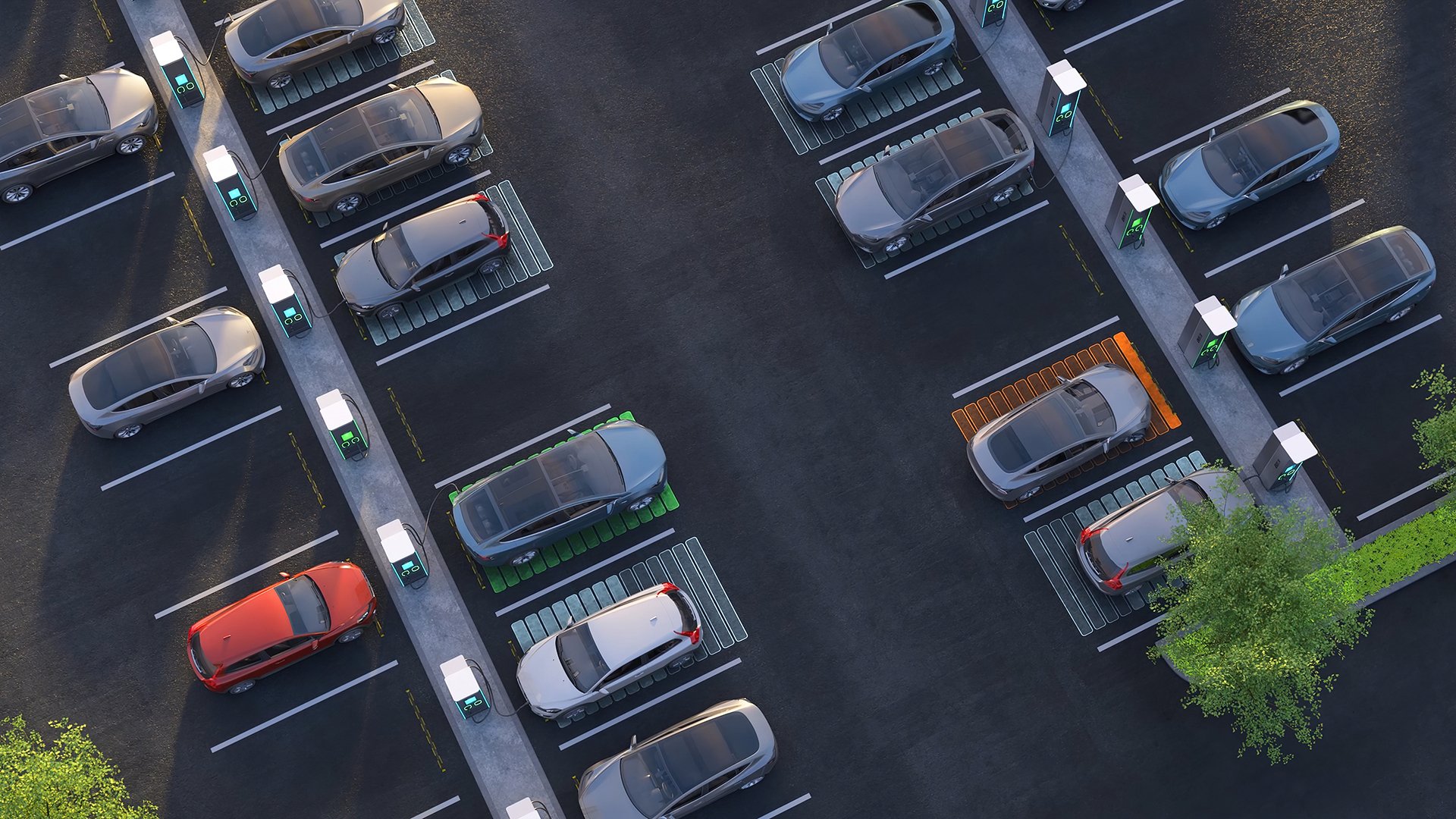 An aerial shot of multiple cars charging on a parking lot, the visual is edited to represent the status of a charge, green is full, gray is charging, orange is nearly empty.
