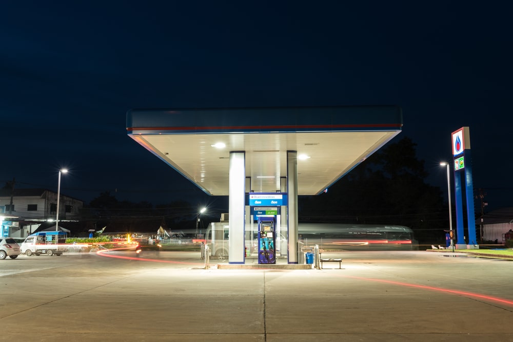 A gas station at night.