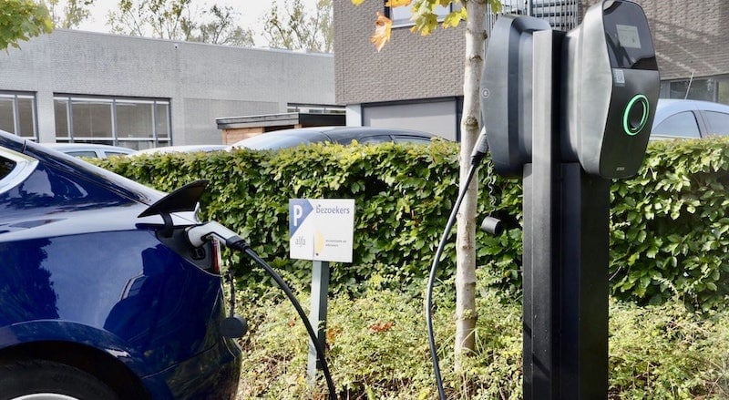 An EV is being charged by EVBox Liviqo charging station.