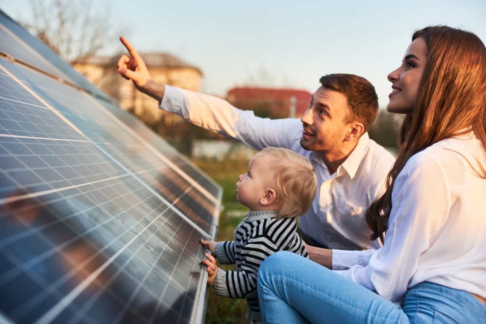 A family looking at solar panels.