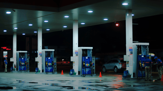 Gas station at nights showing different pumps