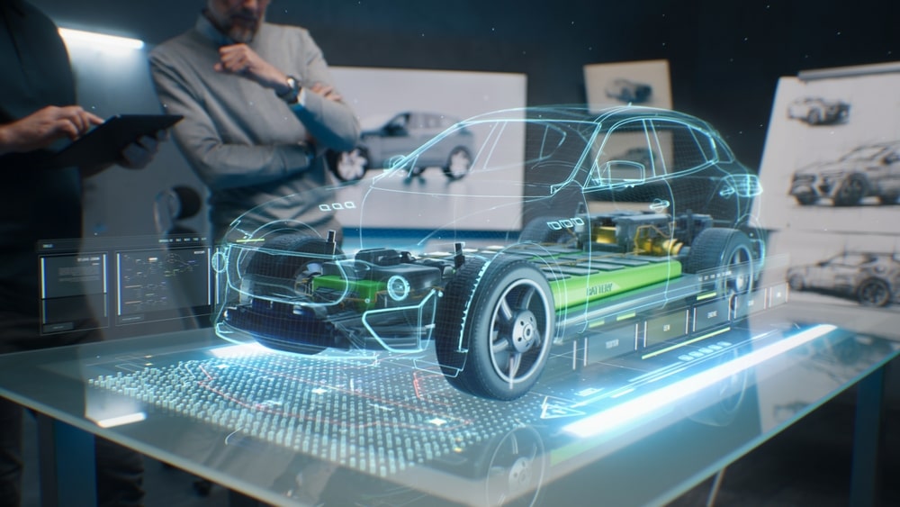 Two business men look at a 3D, holographic model of an EV.
