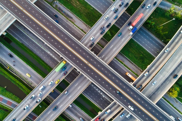 An aerial shot of many different highway overpasses crossing.